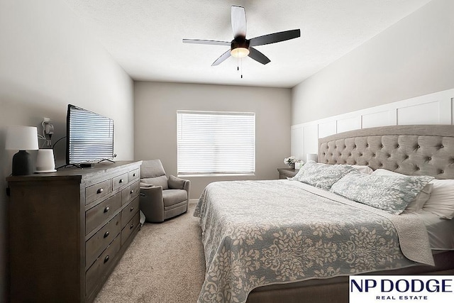 bedroom featuring light colored carpet and ceiling fan