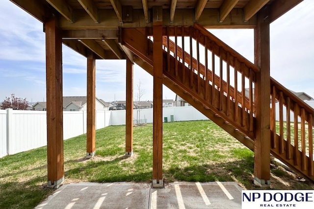 view of patio / terrace featuring stairway and a fenced backyard