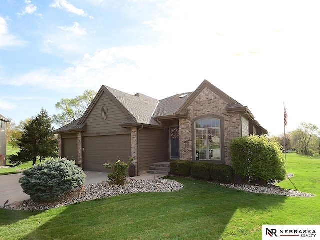 single story home with a front lawn, driveway, an attached garage, brick siding, and roof with shingles