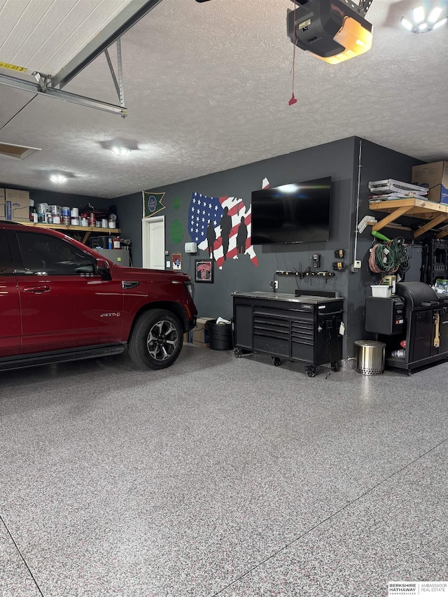garage featuring a garage door opener