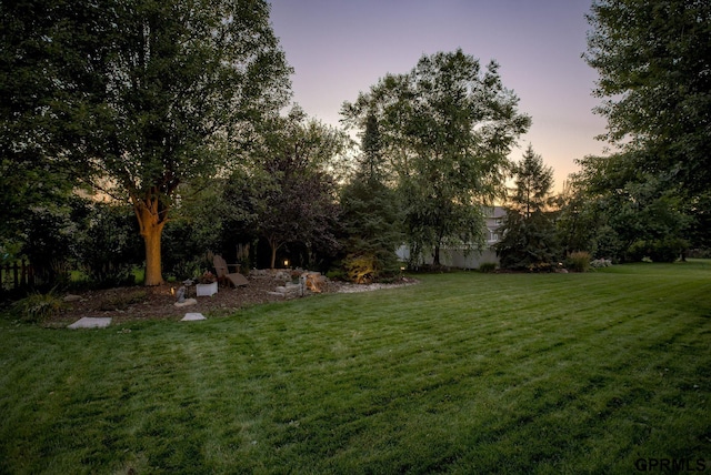 view of yard at dusk