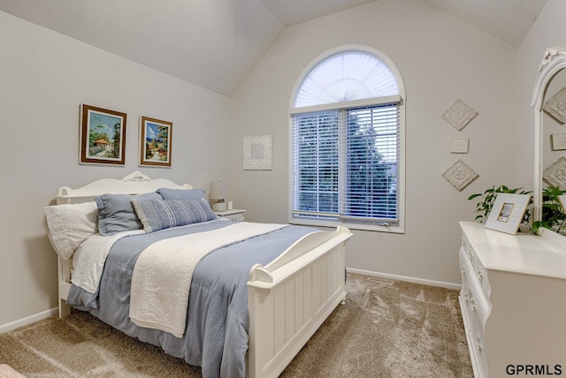 bedroom with baseboards, light carpet, and lofted ceiling
