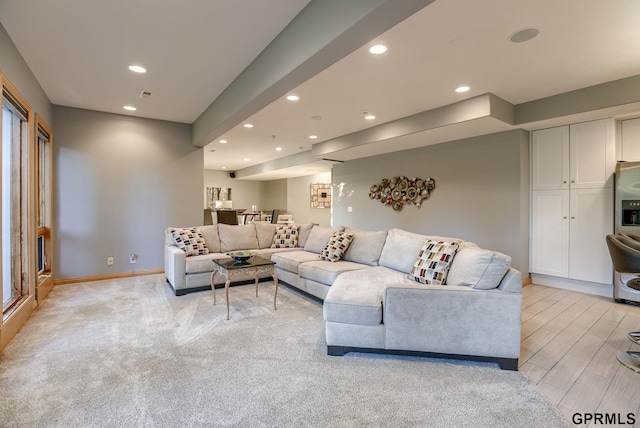 living area featuring recessed lighting, baseboards, and visible vents