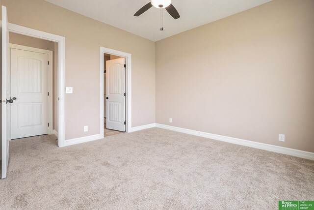 unfurnished bedroom with carpet, baseboards, and ceiling fan