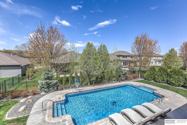 view of pool featuring a residential view, a fenced in pool, a patio, and a fenced backyard