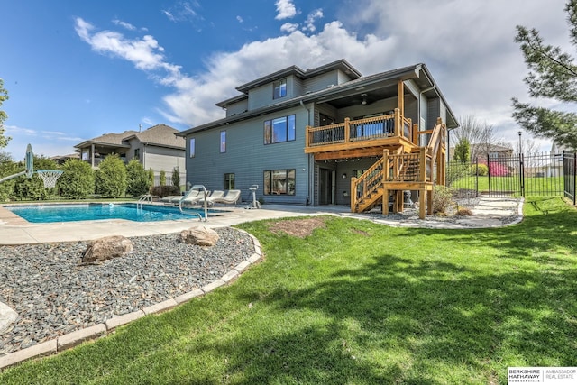 back of property featuring a yard, a patio, stairs, and ceiling fan
