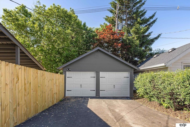 detached garage with fence