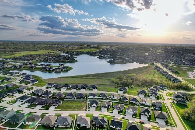 birds eye view of property featuring a water view and a residential view