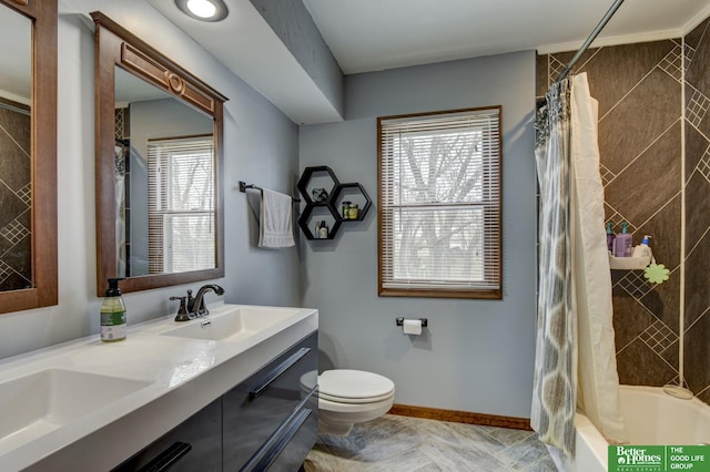 bathroom with vanity, toilet, baseboards, and shower / bathtub combination with curtain