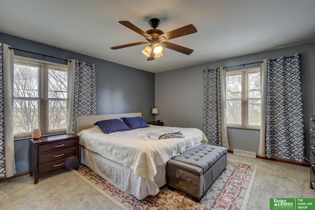 bedroom with light carpet, baseboards, visible vents, and ceiling fan