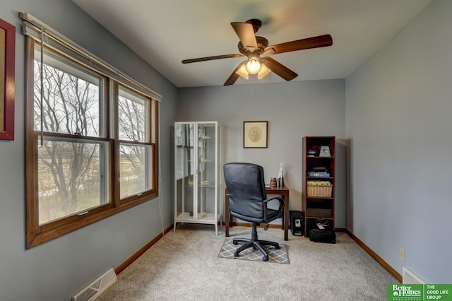 home office featuring carpet floors, visible vents, baseboards, and ceiling fan
