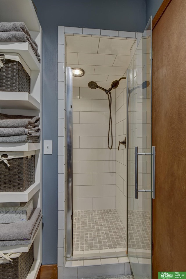 bathroom with a shower stall