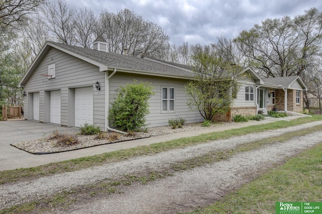 view of front of property with brick siding and a shingled roof