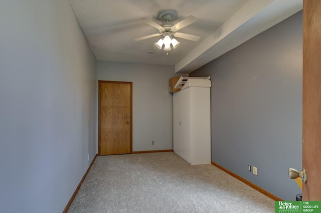 unfurnished bedroom featuring carpet floors and baseboards