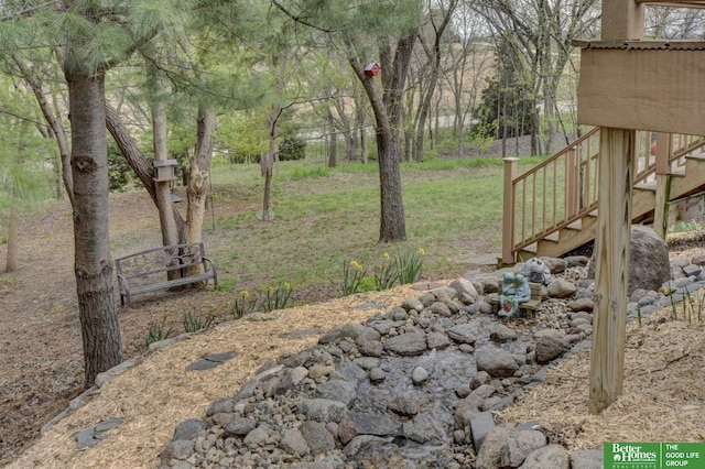 view of yard featuring stairway