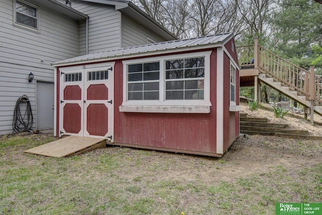 view of shed featuring stairs