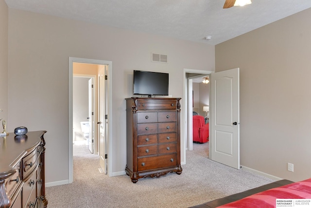 bedroom featuring light carpet, baseboards, and visible vents