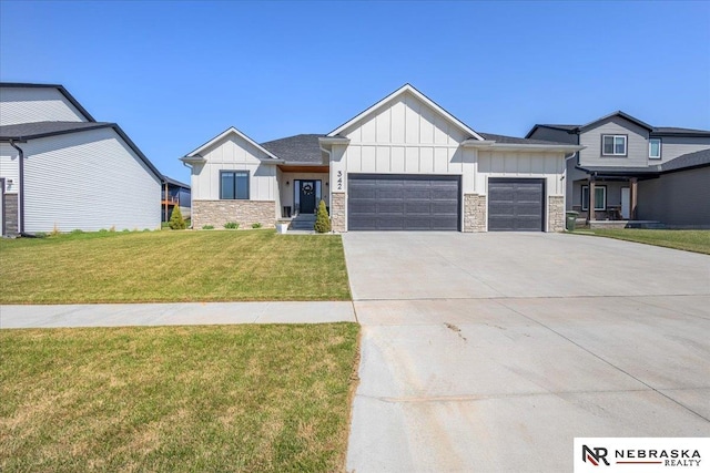 view of front of house featuring driveway, a front yard, board and batten siding, and a garage