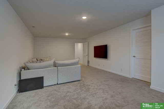 living room with recessed lighting, carpet floors, and baseboards