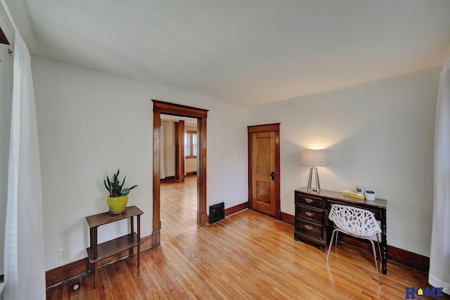 interior space with light wood-type flooring and baseboards