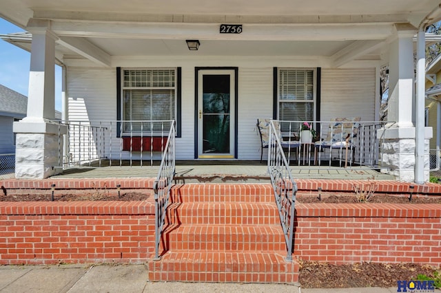 entrance to property with a porch