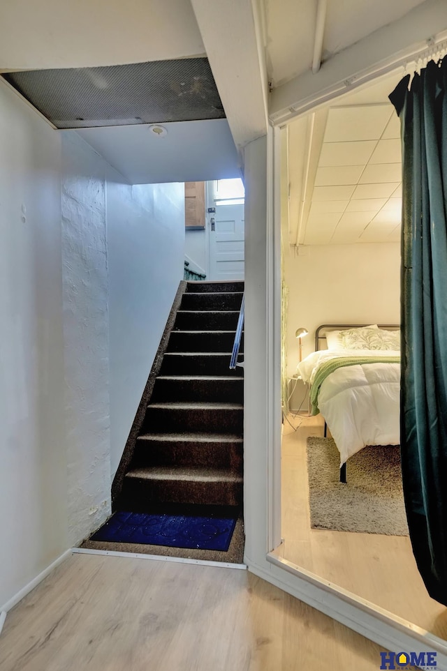 staircase with wood finished floors