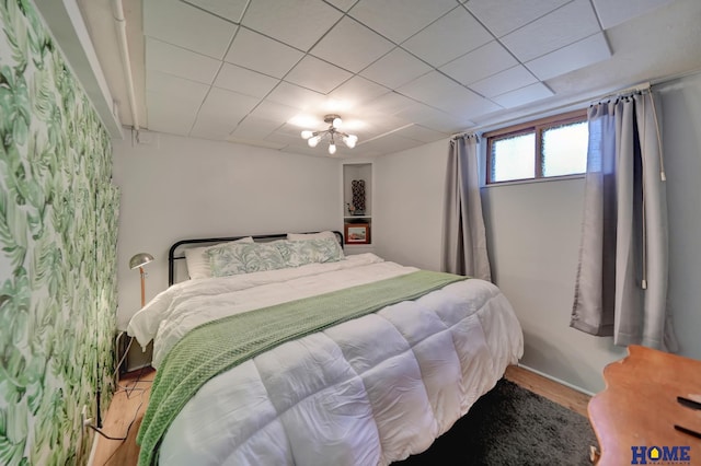 bedroom with wood finished floors