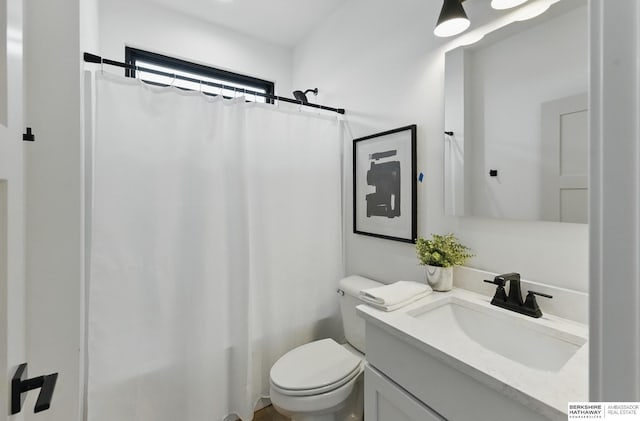 16951 Benjamin St, Bennington, NE 68007 - bathroom with toilet, vanity, and a shower with shower curtain