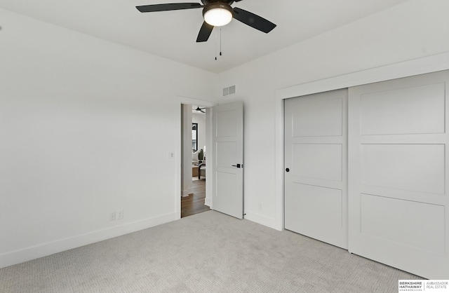 16951 Benjamin St, Bennington, NE 68007 - unfurnished bedroom featuring light carpet, baseboards, a closet, and a ceiling fan