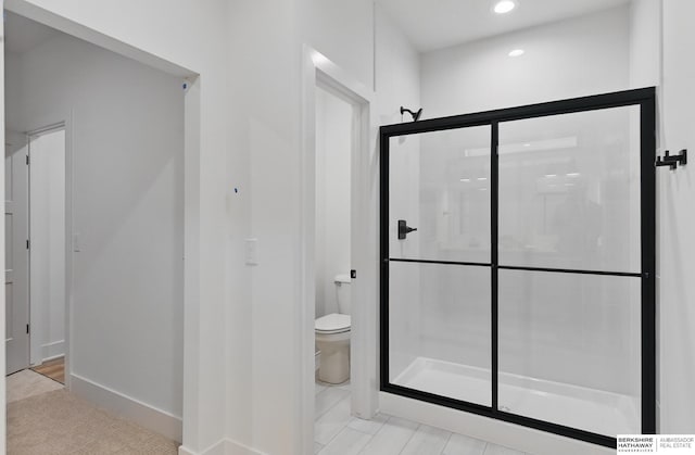 16951 Benjamin St, Bennington, NE 68007 - bathroom with a stall shower, toilet, recessed lighting, and baseboards