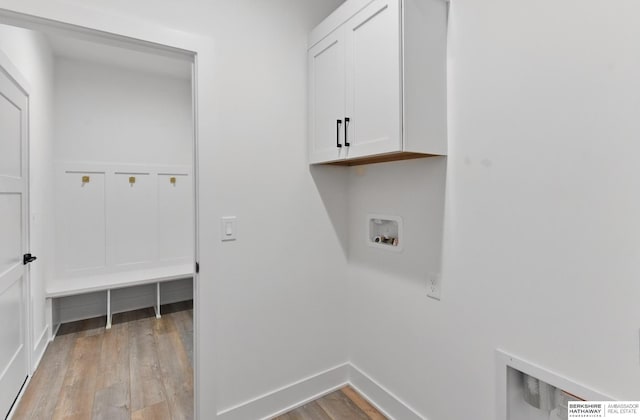 16951 Benjamin St, Bennington, NE 68007 - laundry room with cabinet space, light wood-style flooring, hookup for a washing machine, and baseboards
