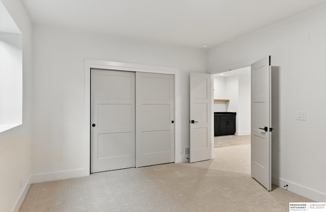 16951 Benjamin St, Bennington, NE 68007 - unfurnished bedroom featuring light colored carpet, baseboards, and a closet
