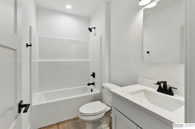 16951 Benjamin St, Bennington, NE 68007 - bathroom featuring toilet, wood finished floors, bathtub / shower combination, and vanity