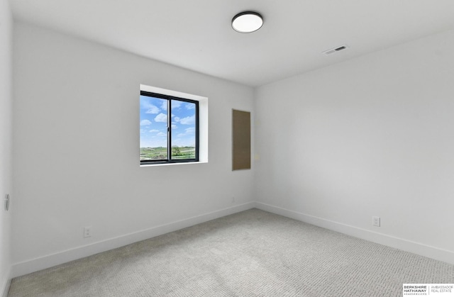 16951 Benjamin St, Bennington, NE 68007 - empty room featuring light carpet and baseboards
