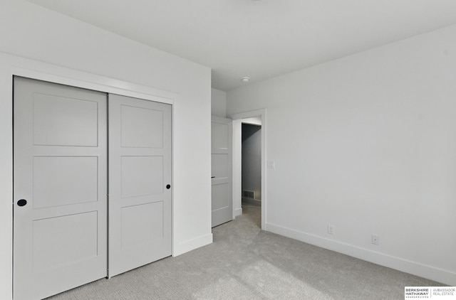 16951 Benjamin St, Bennington, NE 68007 - unfurnished bedroom with light carpet, baseboards, and a closet
