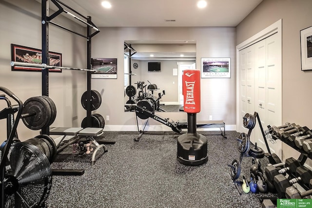 workout area with baseboards, visible vents, and recessed lighting