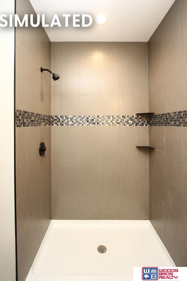full bathroom with tiled shower