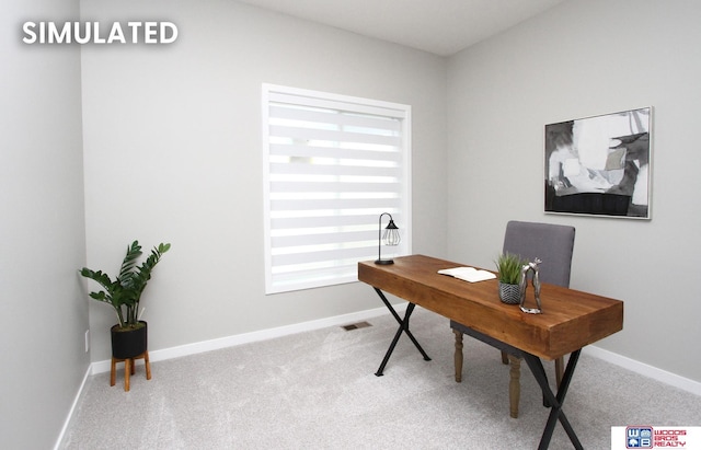 carpeted office with baseboards and visible vents