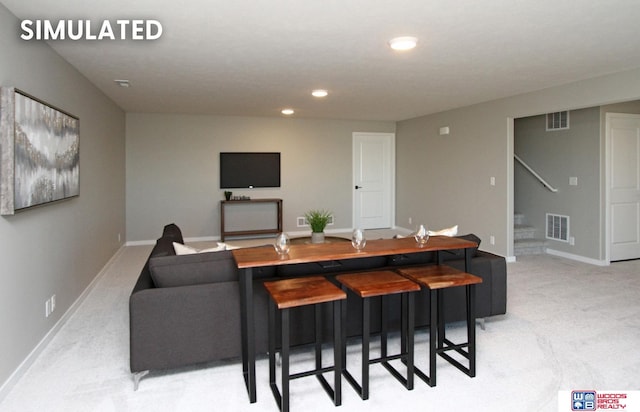 living area featuring stairs, light carpet, baseboards, visible vents, and recessed lighting