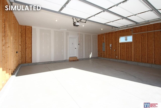 garage featuring electric panel, wood walls, and a garage door opener