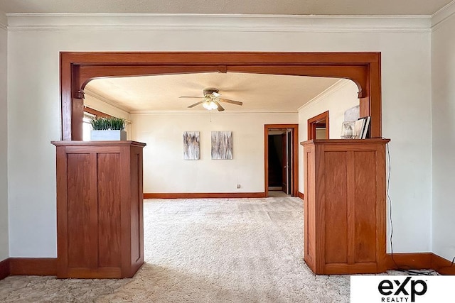 5238 S 20th St, Omaha, NE 68107 - spare room featuring light carpet, crown molding, baseboards, and a ceiling fan