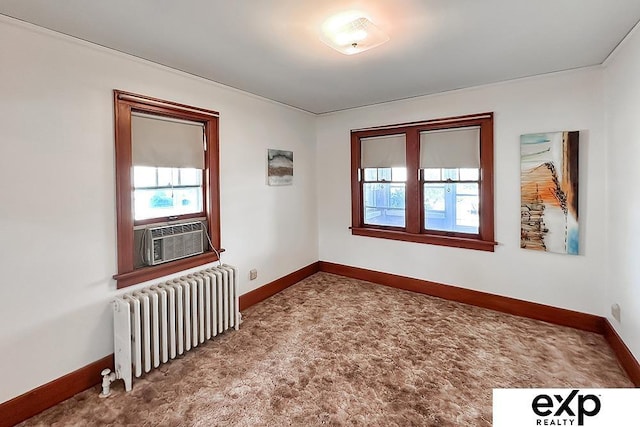 5238 S 20th St, Omaha, NE 68107 - carpeted empty room featuring radiator heating unit, cooling unit, and baseboards