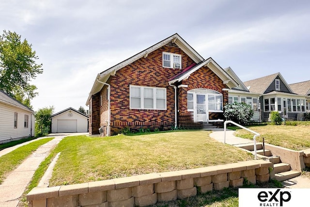 5238 S 20th St, Omaha, NE 68107 - view of front of property with brick siding, a garage, an outbuilding, a front yard, and driveway