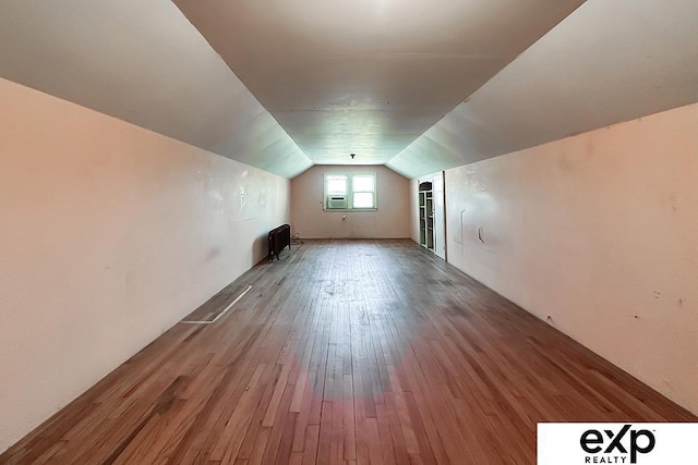 5238 S 20th St, Omaha, NE 68107 - bonus room with lofted ceiling, hardwood / wood-style floors, and cooling unit