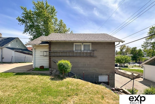 5238 S 20th St, Omaha, NE 68107 - view of front of house featuring roof with shingles and concrete block siding