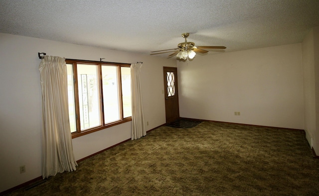 103 Francis St, Daykin, NE 68338 - empty room with a ceiling fan, dark colored carpet, a textured ceiling, and baseboards