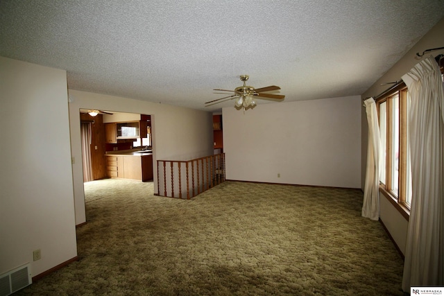103 Francis St, Daykin, NE 68338 - carpeted spare room featuring ceiling fan and a textured ceiling