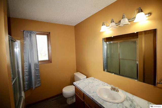 103 Francis St, Daykin, NE 68338 - full bath with a shower with shower door, toilet, vanity, and a textured ceiling