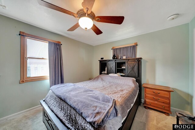 3317 N 9th St, Lincoln, NE 68521 - bedroom featuring ceiling fan, baseboards, and light colored carpet