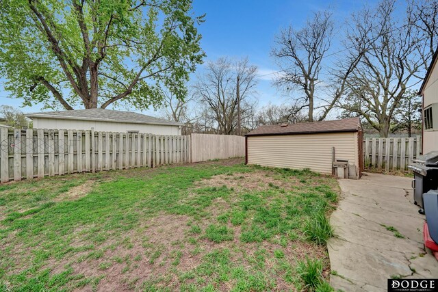 3317 N 9th St, Lincoln, NE 68521 - view of yard featuring an outdoor structure and a fenced backyard
